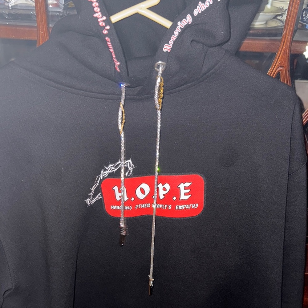 Black HOPE Hoodie with Red Logo And Diamond Strings And A Thorn Of The Crown.